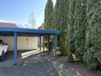 Carport - Großzügige Eigentumswohnung mit unverbautem Boddenblick, großer Terrasse, Garten und Kamin